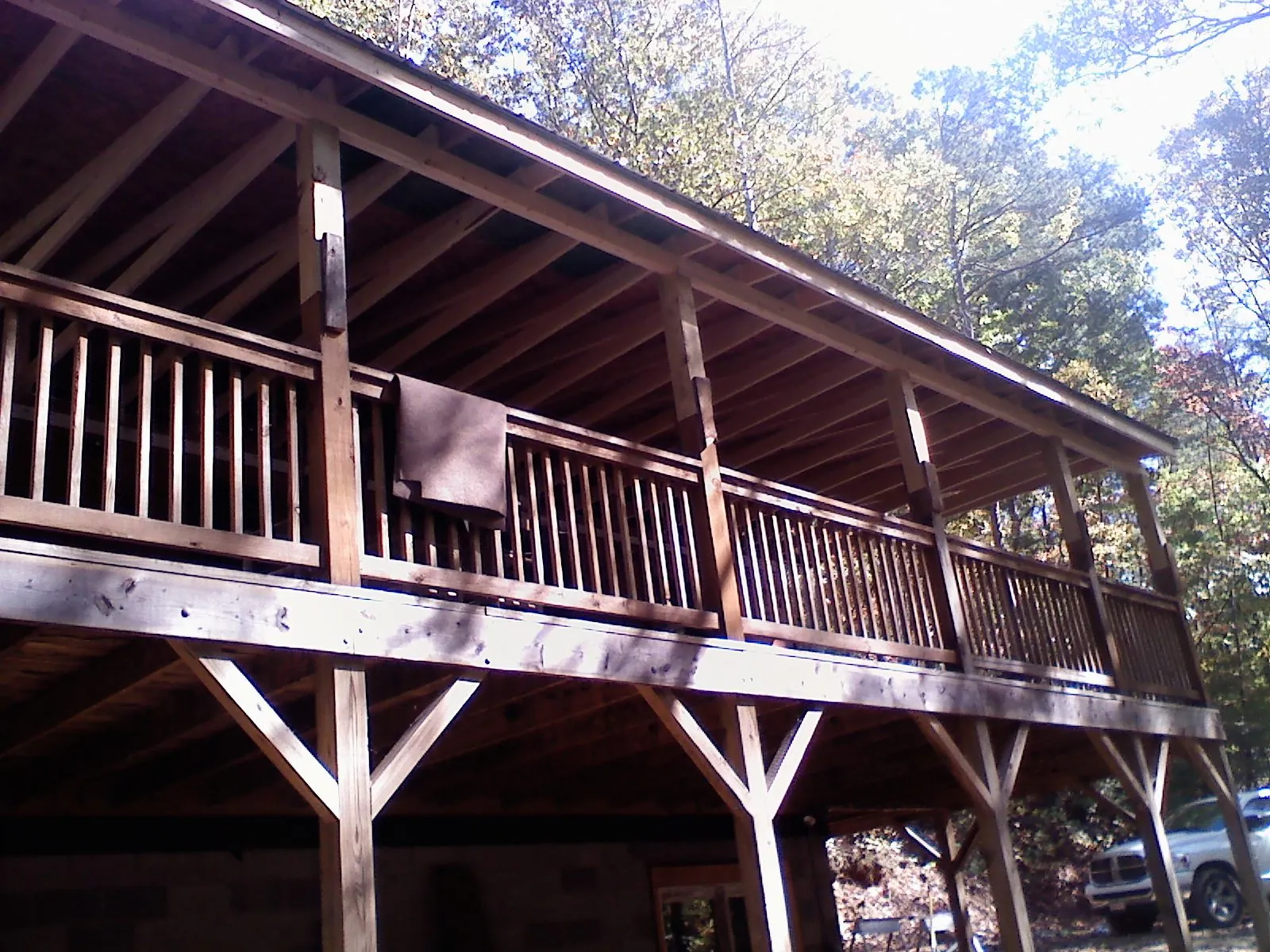 Timber framing under a new elevated porch and deck — Roof Leak Repair in Center Tuftonboro by Roofing Brothers